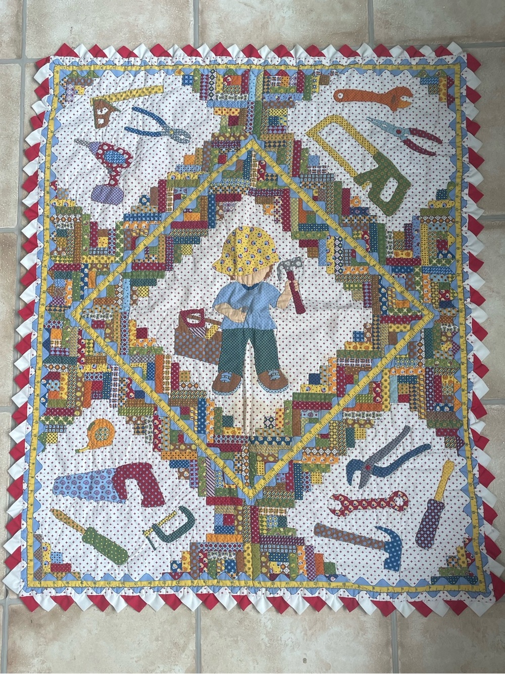 Handmade vintage child’s patchwork Bob the Builder quilt, construction tools